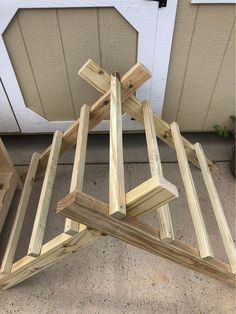 a wooden structure sitting on the ground next to a door