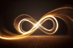 an image of a light painting in the shape of a infinite sign on a dark background