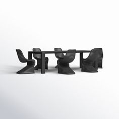 three chairs and a table in the shape of people sitting at a table with their legs crossed