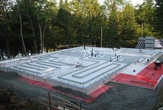 a large concrete structure is being built in the woods