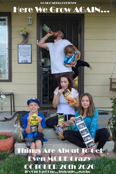 a group of people sitting on the front steps of a house