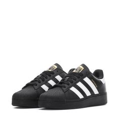 When you thought the adidas Superstar shoes could not get any bolder, this pair amplifies the classic '70s trainer for modern fashion. The enlarged proportions and the equally big statement are made apparent with the iconic serrated 3-Stripes. The full leather upper stays true to its vintage roots while reimagining the silhouette to keep things fresh. Take every step in confidence when the shell toe leads the way. Regular fit. Lace closure. Leather upper. Textile lining. Rubber outsole. Imported Adidas Superstar Men, Black Adidas Superstar, Adidas Shoes Mens Sneakers, Black Superstars, Adidas Superstar Black, Superstar Adidas, Shoes Png, Black Superstar, Adidas Superstars