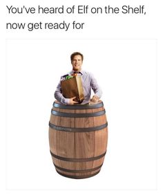 a man sitting on top of a wooden barrel holding a paper bag with the words you've heard elf on the shelf, now get ready for