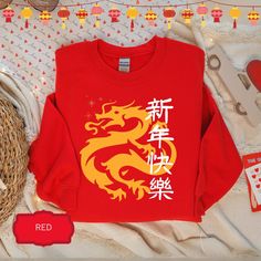 Red Chinese New Year Sweatshirt, cozy, warm, and ideal to celebrate the Lunar New Year. This Year of the Dragon Sweater features  a red Chinese Dragon, the perfect Gift for Chinese Friend. ~ About this Sweatshirt: Our sweatshirts are made of 50% cotton, 50% polyester, medium-heavy fabric, providing comfort and warmth with loose fit.  ~ Returns, Exchanges & Cancellations Since our items are often customized and made-to-order, we cannot issue refunds, exchanges, or cancellations in other cases. Please contact us if you have any questions. ~ Care Instructions Machine wash cold (max 30C or 90F), do not bleach, do not tumble dry, do not iron, do not dry clean.  ~ Notes The position of the design, as well as the color and size, may be slightly different from the photos.  Please feel free to ask Dragon Sweater, Red Chinese Dragon, Clean Notes, Year Sweatshirt, Chinese Clothes, New Year Shirt, New Years Shirts, Red Pullover, Year Of The Dragon