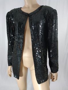 Exquisite! Captivating! Elevate your style with Black Sequin Jacket 80's Women's 100% Silk Fully Lined Shoulder Pads Disco Gorgeous Like New w Tags Condition Vintage by CHAMP ELLYSE Size S, available for a limited time at the incredible price of $78.00
#BlackSequinJacket #WomensSequinJacket #BlackJacket #70sSequinJacket #VintageSequin #70sVintage #80sSequinJacket #DiscoJacket #SequinDiscoJacket #SequinJacket Vintage Tops For Night Out In Winter, Retro Winter Party Tops, Retro Winter Party Top, Vintage Outerwear For Night Out In Spring, Retro Long Sleeve Party Blazer, Vintage Party Blazer For Winter, Vintage Winter Outerwear With Sequins, Vintage Blazer For Fall Party, Vintage Winter Party Blazer