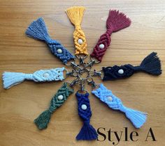 a bunch of tassels that are on top of a wooden table with the words style a written below them