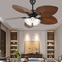 a living room with a ceiling fan in the middle and two lights on each side