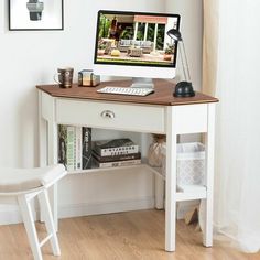 a white desk with a computer on it