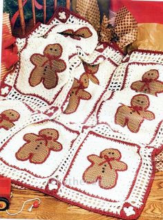 a crocheted teddy bear afghan is on the floor