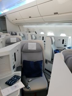 the inside of an airplane with many seats