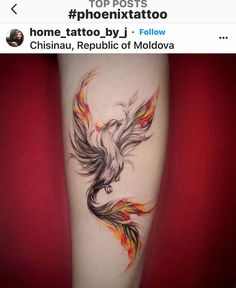 a tattoo on the leg of a woman with a bird in it's wings