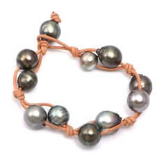 11 Tahitian Pearls Knotted on Leather Bracelet     * Tahitian Pearls    * Leather    * Pearl Toggle Closure   * 8.25" Length    * P-4754 Pearl Leather, Tahitian Pearls, Bezel Diamond, Halo Diamond, Pearl Bracelet, Gold Diamond, Leather Bracelet, Bracelet, Chain