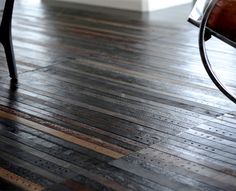 a bench sitting on top of a wooden floor