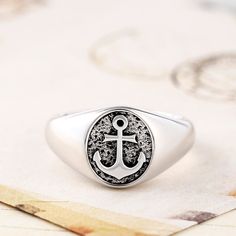 Inspired by intrepid sea adventures, our Anchor Men's Ring will take you away to the world where pirates rule the land. Crafted in sterling silver, this masculine accessory has an impressive level of detail. Wear on its own - the exquisite amount of detail requires no additional accessorizing or style to help finish off an outfit to perfect.Weight: 5.32 gWidth: 11.1 mmHeight: 3.7 mmThickness: 2.8 mmMaterial: Plating Color: Silver Men's Wedding Bands, Navy Anchor, Adventure Of The Seas, Sterling Silver Mens Rings, Mens Silver Rings, Sterling Silver Mens, Mens Band, Men's Ring, Silver Man