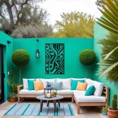 an outdoor living area with couches, tables and potted plants