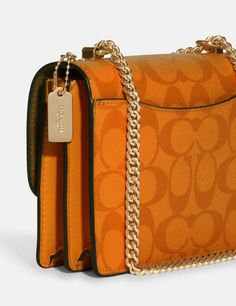 Signature coated canvas and smooth leatherInside multifunction and zip pocketsSnap closure, fabric liningOutside open pocketHandles convert to shoulder strap with 22" drop7" (L) x 5 1/4" (H) x 2" (W)Style No. C9946Color: Light Orange Luxury Orange Coach Bag, Luxury Orange Coach Shoulder Bag, Coach Hudson Small Pack, Coach Bag Orange, Mini Pepper Crossbody Coach, Orange Guess Duffel Crossbody Purse, Coach Crossbody Bag Yellow, Lighted Canvas, Signature Canvas