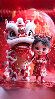 two figurines are standing next to each other in front of red and white decorations