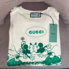 Technically A Men’s Xs But I Purchased As Women’s To Wear Oversized. Tags Still Attached, Never Worn. Bought From Gucci On Rodeo Drive 2020 Lightweight Fabric Cotton & Hemp Materials. Casual Gucci Tops With Letter Print, Gucci Cotton Top For Streetwear, Casual Gucci Tops For Summer, Designer Green Cotton Tops, Trendy Gucci Tops For Streetwear, Trendy Gucci Tops With Letter Print, Trendy White Gucci Tops, Designer Gucci Tops With Letter Print, Gucci Cotton Tops With Letter Print