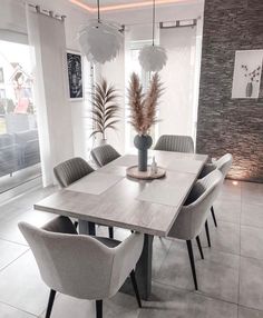 a dining room table with chairs around it