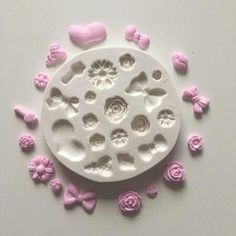 a white plate with pink flowers and hearts on it