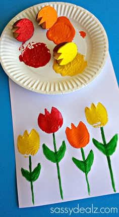 paper plate crafts for kids with flowers and leaves painted on them, including an egg carton