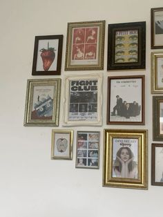 there are many framed pictures on the wall