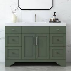 a bathroom vanity with a mirror above it