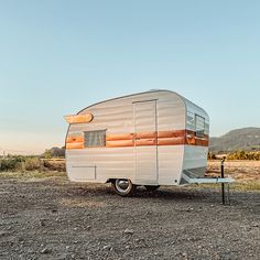 an rv parked in the middle of a field