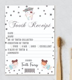 tooth fairy receipt card with toothbrush next to it