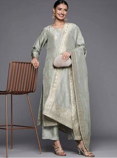 *Grey Woven design Kurta with Palazzos with dupatta *Kurta design:-  *  Woven design self design   *  Straight shape   *  Regular style   *  Sweetheart neck, long regular sleeves   *  1 pockets zari detail   *  Calf length with straight hem   *  Silk fabric *Palazzos design:-  *  Solid Palazzos   *  Partially elasticated waistband   *  Slip-on closure    *Fabric:- Top Fabric: Silk Blend Bottom Fabric: Silk Blend Dupatta Fabric: Silk Blend *Wash Care:- Dry Clean  AVAILABLE IN 6 SIZES THEY ARE IN Designer Gray Set With Zari Work, Festive Gray Zari Work Sets, Gray Anarkali Set With Zari Work, Gray Anarkali Set For Festive Occasions, Gray Anarkali Set With Dupatta, Gray Resham Embroidery Kurta For Wedding, Festive Gray Sets With Dupatta, Festive Gray Diwali Outfit Sets, Gray Festive Sets With Resham Embroidery