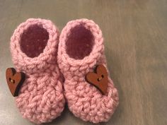 "This adorable little handmade hat and bootie gift set is a special way to announce your pregnancy to parents, family and friends. These cute little handmade hat and booties are packaged in a kraft gift box with tissue paper. The announcement card is placed on top of the hat and booties. The tissue paper is folded over, and the surprise card is put on top. The box is closed and tied with white satin ribbon. There is no indication as to the contents of the box with the hat and booties or the ship Cute Pink Booties For Gift, Cute Pink Booties As Gift, Cute Handmade Pink Booties, Cute Pink Handmade Booties, Pink Booties With Soft Sole For Gift, Pink Booties With Soft Sole As Gift, Handmade Round Toe Booties Gift, Handmade Round Toe Booties As Gift, Pink Crochet Booties With Round Toe