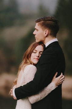 a bride and groom embracing each other