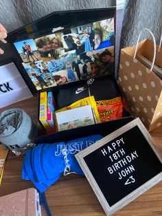 a birthday gift box filled with personal photos and other items for someone's 25th birthday