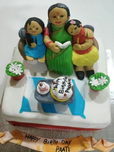 a birthday cake with an image of three people on it