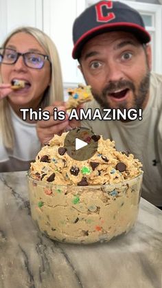 the man and woman are eating cookies out of their cake pans with words reading, this is amazing