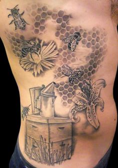 a man's chest with bees and honeycombs on it