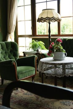 a living room filled with furniture and flowers