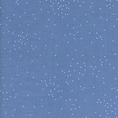 a blue background with small white dots on the top, and bottom half of it