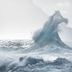 a large wave is breaking in the ocean