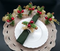 a white plate topped with green napkins and red berries