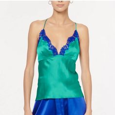 Gorgeous Silk Cami With Contrast Lace Trim. Straps Criss Cross In The Back And Are Adjustable. Binding Below Bust For Extra Support New With Tags, Never Worn! Elegant Green V-neck Camisole, Elegant Fitted Blue Camisole, Elegant Blue Fitted Camisole, Blue Silk Top For Night Out, Elegant Green Satin Camisole, Elegant Blue Camisole For Spring, Black Lace Cami Top, Silk Camisole Top, Lace Camisole Top