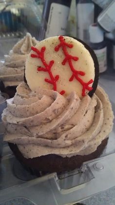 cupcakes with frosting and baseball decorations on top