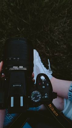 a person holding a camera in their hands