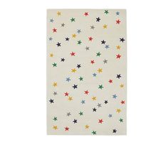 a white rug with multicolored stars on the front and back of it,