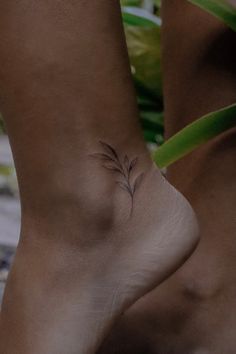 Minimalistic tattoo Ankle Olive Branch Tattoo, Red Olive Branch Tattoo, Small Tattoo Ankle Woman, Beautiful Ankle Tattoos, Small Vines Tattoo, Girly Tattoos Unique Small, Olive Branch Tattoo Dainty, Elegant Ankle Tattoos, Dainty Tattoo Placements