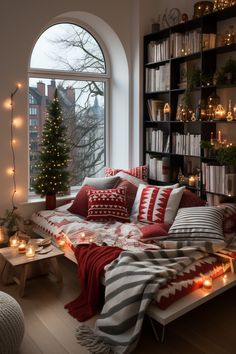 a living room filled with lots of furniture and christmas lights on the window sill