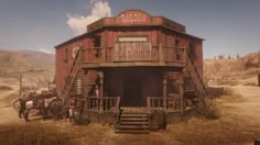 an old red barn with horses in the front and two men standing on the porch