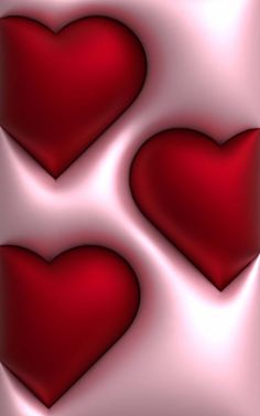 three red hearts are arranged in the shape of heart shapes on a pink and white background