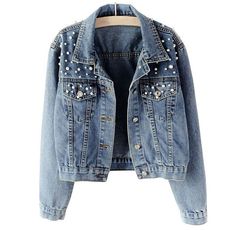 a denim jacket with studded details on the shoulders