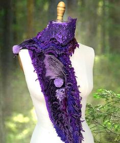 Add a touch of elegance and convenience to your  wardrobe with this unique with beaded lace purple scarf.  Made from up cycled felt cashm., beaded lace, felted wool, Faux fur,  and novelty yarns make this Scarf unique. Perfect for layering, this scarf is generously sized for maximum  warmth and style. Its versatile design allows it to be worn as a wrap, shawl, or cozy neck scarf. The length: 50" (127 cm). Designed for both fashion and functionality, this scarf is perfect for chilly days, travel, or anytime for adding bright rich purple hue to any outfit. What customers say about Amber Studios creations: "Barbara is an outstanding artist who I have bought from for many years. She is so lovely to work with - always kind, friendly and the items I have from her shop are real treats." "I could Fur Shawl Outfit, Shawl Outfit, Whimsical Accessories, Boho Scarf, Purple Scarf, Novelty Yarn, Boho Scarfs, Purple Scarves, Fur Shawl